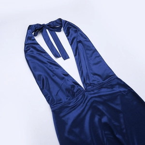 Close-up of deep blue satin evening dress featuring a halter neck and plunging V-neckline
