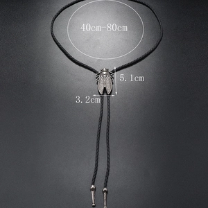 Detailed size view of cicada-shaped silver bolo tie pendant with woven leather cord necklace