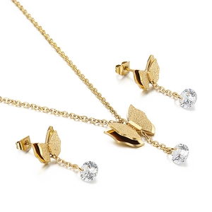 Elegant gold butterfly jewelry set featuring frosted pendants and sparkling rhinestones