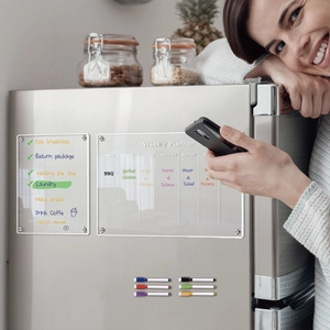 Acrylic magnetic weekly planner set on a silver fridge with six colorful markers