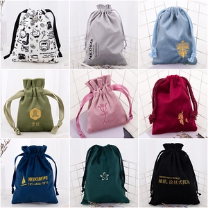 Macro view of various velvet and canvas drawstring bags for jewelry gift packaging