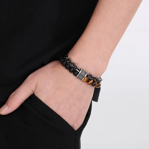 Detail of tiger eye and matte stone beads with double-layer stainless steel chain for men