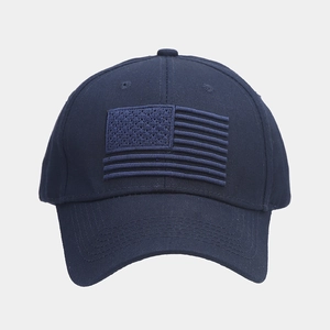 Detailed close-up of navy blue baseball cap with 3D American flag embroidery on front