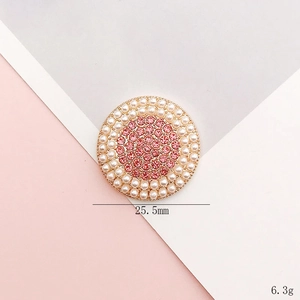 Detailed top view of 25.5mm pink rhinestone and pearl charm with golden metal base