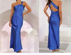 Detail of royal blue satin evening gown showing the elegant one-shoulder and open-back design