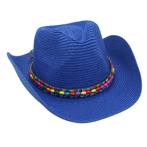 Detailed weave of a dark blue straw cowboy hat with colorful ethnic beaded band accent