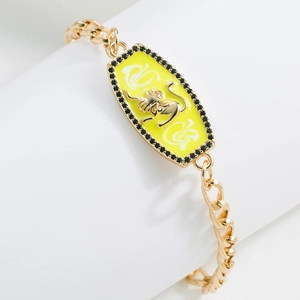 Detailed view of 18K gold plated Leo zodiac bracelet with yellow enamel and black crystals
