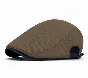 Detail of coffee duckbill hat featuring twill texture, metal eyelets and blue strap