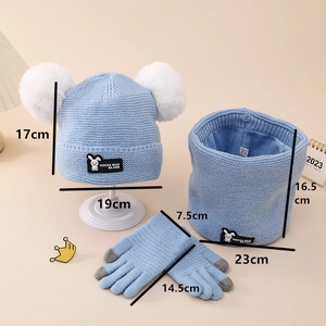 Detailed view of kids' winter knitted set with plush lining and dual pom-poms in light blue