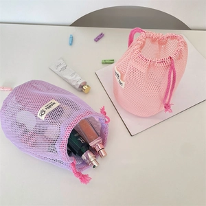 Large mesh drawstring bag in purple and pink for toiletries and cosmetic storage