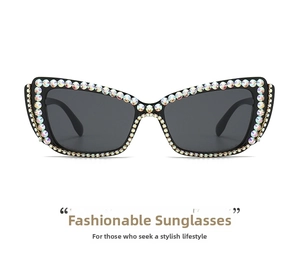 Detail of luxury cat-eye sunglasses featuring hand-set AB rhinestones on black frames