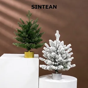Rotating Christmas tree music box in green and snow-flocked styles on metallic bases