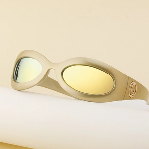 Detail of retro oval gold frame cycling sunglasses with yellow reflective lenses