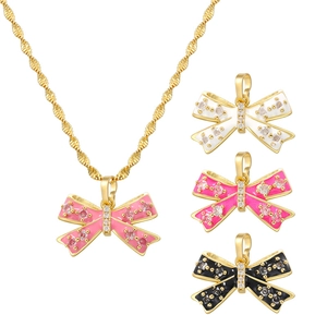 Elegant gold bow pendant necklace with colorful enamel finish and zircon accents