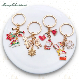 Christmas theme keychain set with enamel Santa snowman and tree charms in gold finish