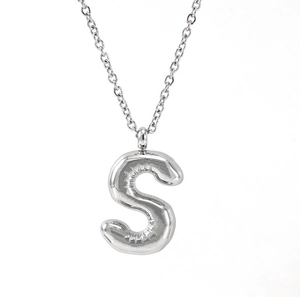 Detailed view of silver bubble letter S pendant with 3D inflatable metallic gloss finish