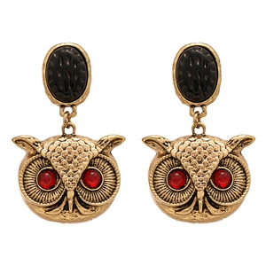 Vintage bronze owl earrings with red gem eyes and black textured oval studs