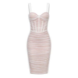 Detailed view of the layered white mesh over beige lining on the ruched party dress