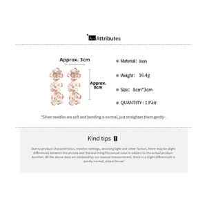 Detailed size chart for white floral tassel earrings with silver needles and iron material
