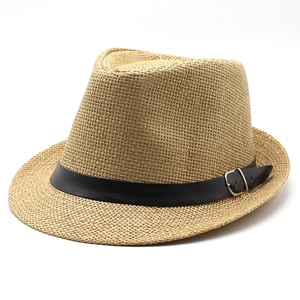 Detail of fine straw weave texture with black leather belt and silver buckle on fedora hat