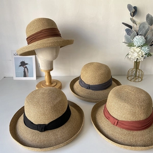 Elegant wide brim straw sun hats for women in four colors with decorative ribbon bands
