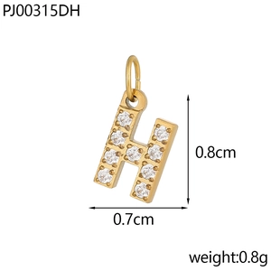 Macro detail of a golden letter H pendant with micro-paved zircons and precise dimensions