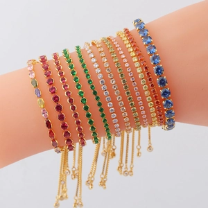 Detail of colorful zircon slider bracelets featuring diverse gemstone cuts in gold settings