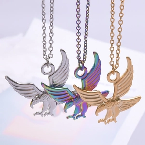 Three eagles soaring pendant necklaces in silver, gold, and rainbow stainless steel