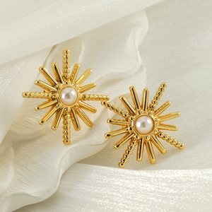 Elegant 18K gold plated starburst earrings with central pearl on silk fabric