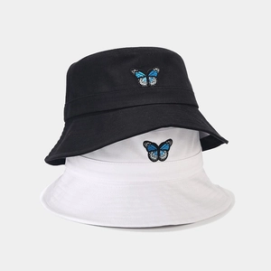 Classic cotton bucket hat with blue butterfly embroidery in black and white colors