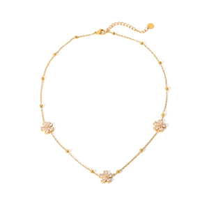 Detail of 18K gold chain with three crystal flower pendants and adjustable lobster clasp
