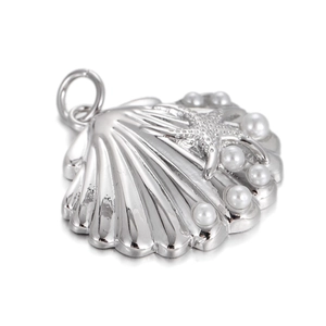 Detailed view of silver shell pendant with starfish and white pearl accents on white background
