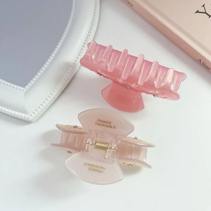 Elegant bow hair claws in pink and beige acetate with crystal rhinestones for women