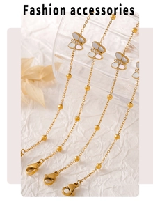 Detail of 18k gold butterfly bracelet with mother of pearl and cubic zirconia accents