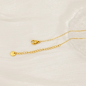 Detail of 18k gold plated stainless steel necklace clasp with adjustable chain and S. Steel tag
