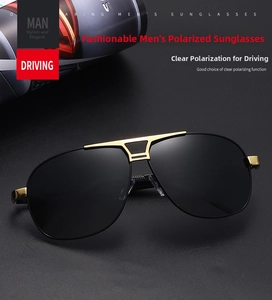 Detail of polarized men's pilot sunglasses with golden metal bridge and black lenses