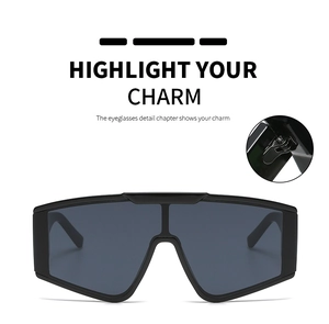 Detail view of large shield sunglasses with durable hinges and dark gray lenses