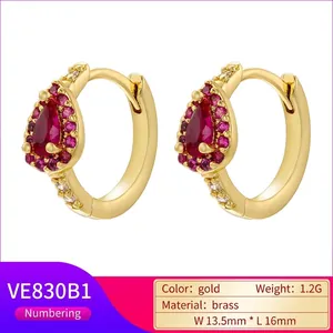 Gold plated brass earrings with teardrop red stones and pavé zircon settings
