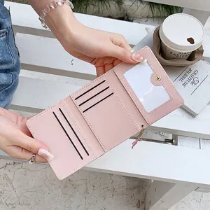 Cute light pink trifold wallet for women with multiple card slots and metal chain detail