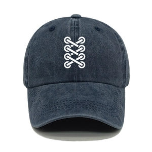 Deep blue washed denim baseball cap with white cross-lace embroidery on a white background
