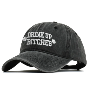 Vintage washed black baseball cap with Drink Up Bitches embroidery for St. Patrick's Day