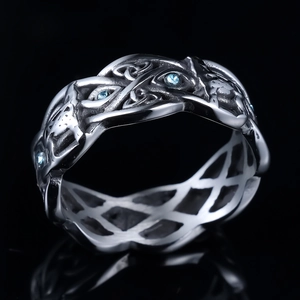 Vintage Celtic knot wolf head ring in stainless steel with blue stone on black background