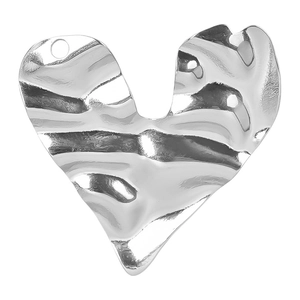 Macro detail of silver 304 stainless steel heart pendant with irregular wavy texture
