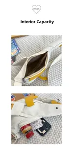 Internal capacity of duck-shaped canvas shoulder bag showing phone and wallet storage