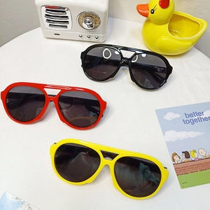 Kids round frame sunglasses with UV protection in black, red, and yellow colors