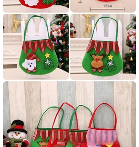 Detail of felt Christmas gift bag featuring snowman embroidery and 18cm width measurement