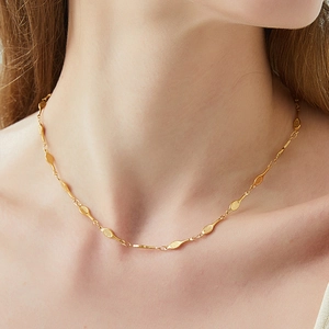 Creative gold tennis racket necklace set with intricate grid texture and chain links