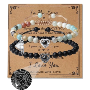 Three-piece beaded bracelet set with heart projection stone on vintage message card