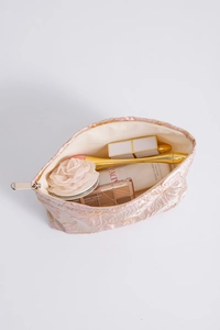 Macro view of floral jacquard makeup bag interior with large capacity storage space