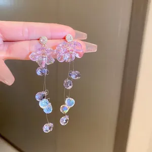 Elegant purple crystal tassel drop earrings with frosted flower and sparkling rhinestones